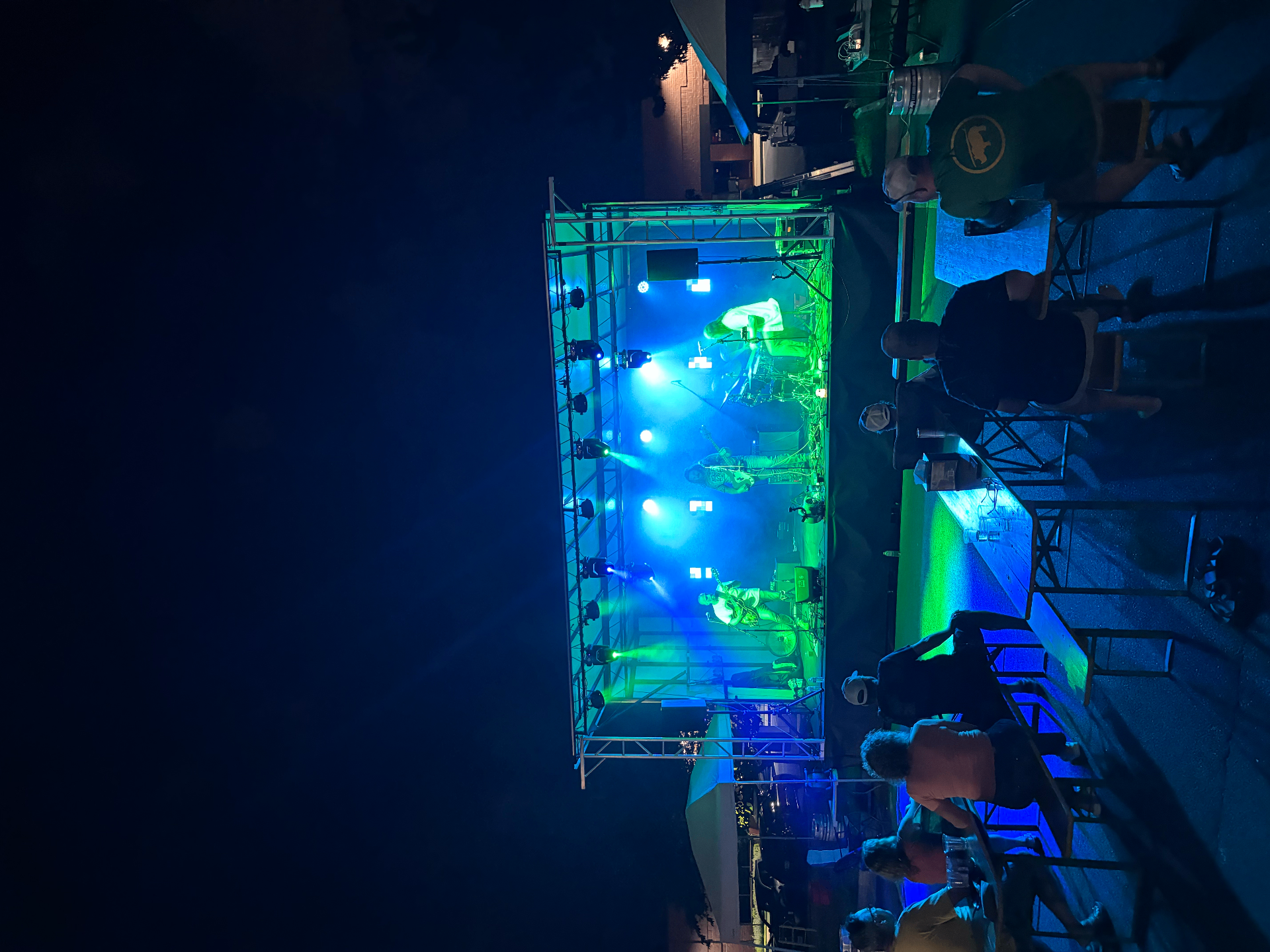 Stage with blue and green lighting at night